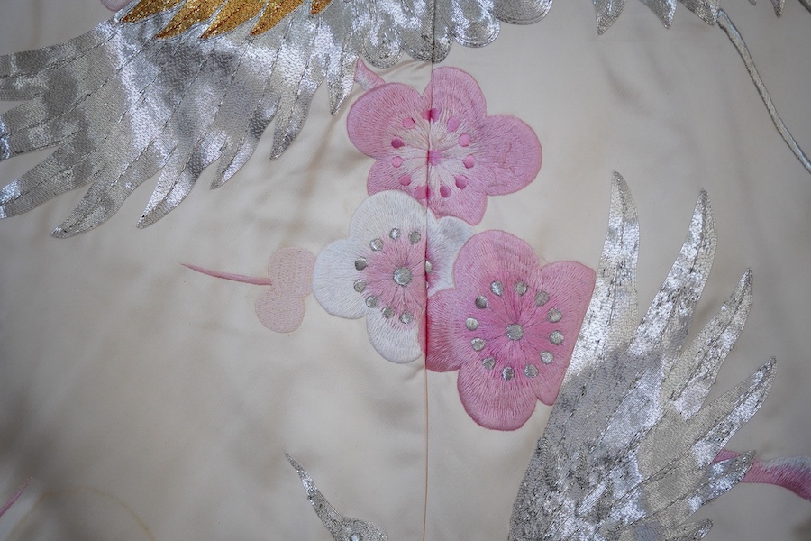 A Japanese pale pink silk floral and metallic thread bird embroidered wedding kimono, 184cm long.